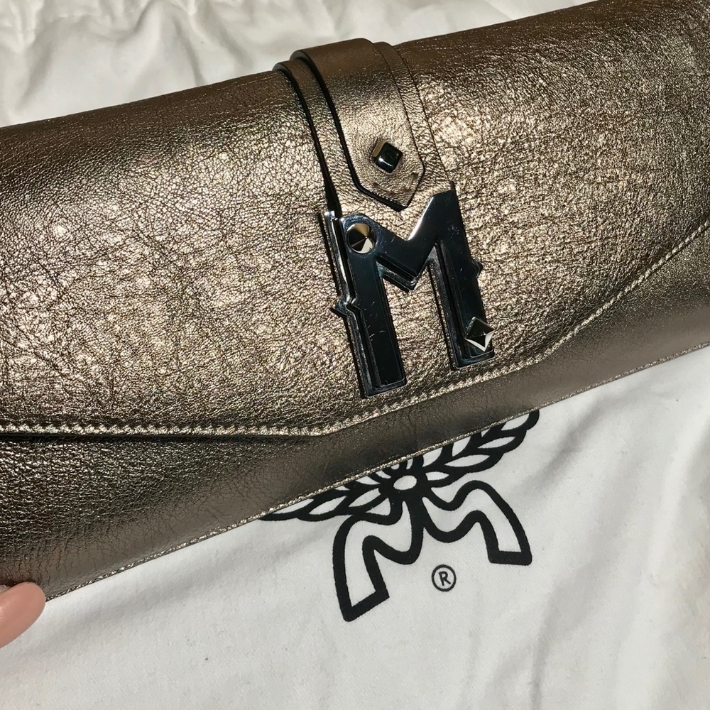 Authentic mcm clutch purse bronze black